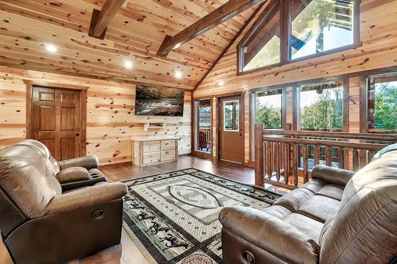 Your cabin's large glass windows lets in plenty of light and outdoor views. at Cabin Fever Vacation in Gatlinburg TN