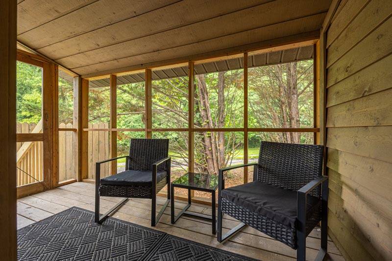Enjoy nature and not the bugs from your screened porch. at Pigeon Forge Getaway in Gatlinburg TN
