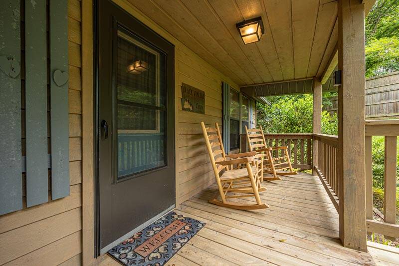 Your charming cabin's front porch. at Pigeon Forge Getaway in Gatlinburg TN