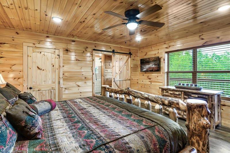 Enjoy this spacious bedroom with personal tv. at Enchanted Spirit in Gatlinburg TN