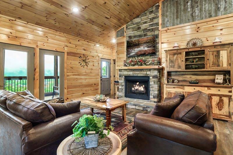 Cabin living room with gas log fireplace. at Enchanted Spirit in Gatlinburg TN