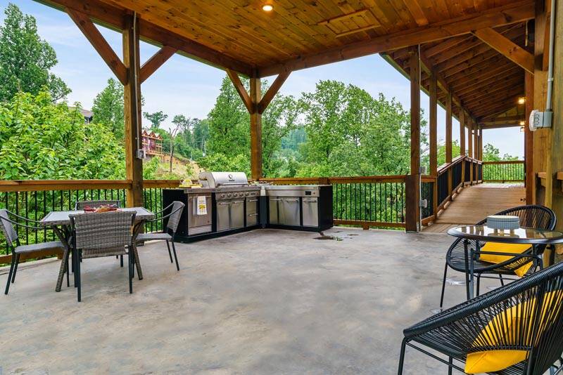 The family will surely enjoy the outdoor dining experience at your cabin in the Smokies. at Enchanted Spirit in Gatlinburg TN