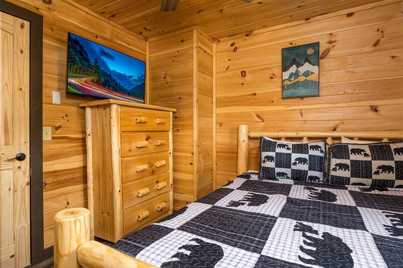 Rental cabin bedroom with tv. at Mountain Creek View in Gatlinburg TN