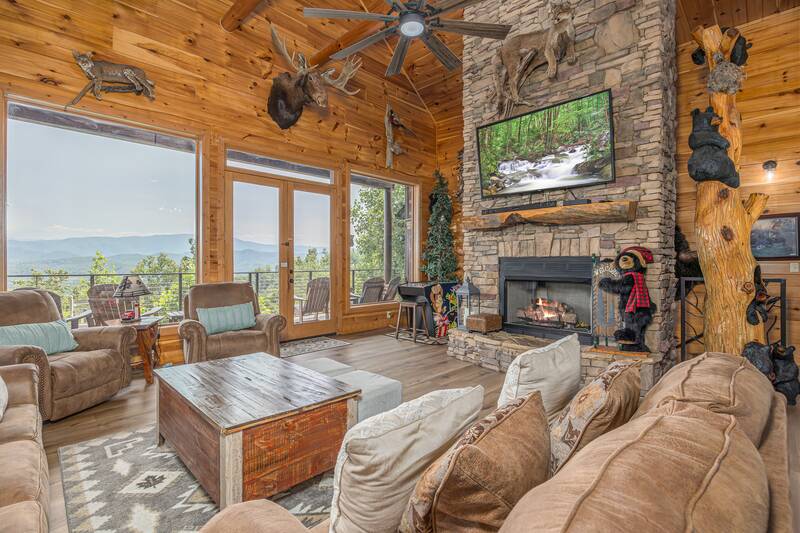 Enjoy the warmth of the double sided stacked stone fireplace. at Five Bears Mountain View Lodge in Gatlinburg TN