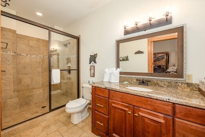 Bath with large tiled and glass shower. at Five Bears Mountain View Lodge in Gatlinburg TN