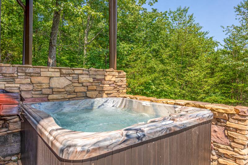 Tan as you relax in this large hot tub. at Five Bears Mountain View Lodge in Gatlinburg TN