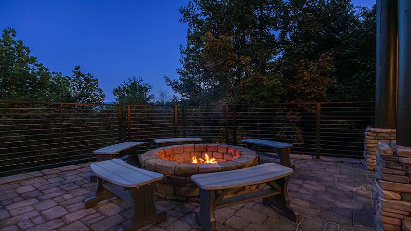 Gather round the fire pit at your cabin in the Smokies. at Five Bears Mountain View Lodge in Gatlinburg TN