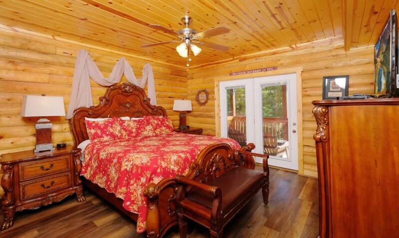 Master bedroom with personal walk out doorway to the porch. at Applewood Manor in Gatlinburg TN