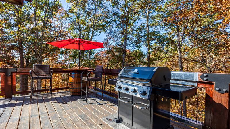 Gas grill on your Sevierville cabin's large wrap around deck. at Stonehenge Cabin in Gatlinburg TN