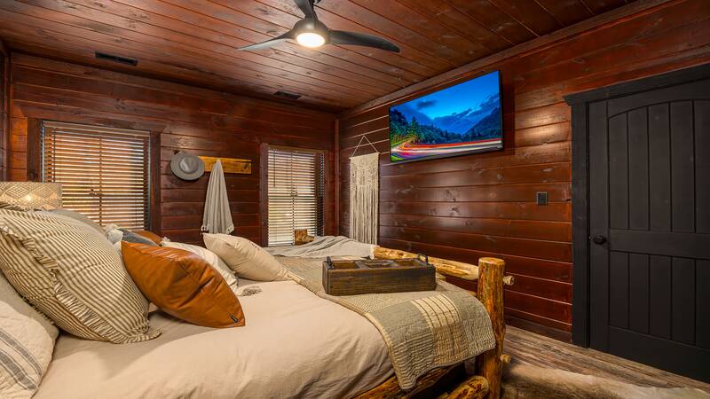 Watch late night shows on your bedroom's personal tv. at Stonehenge Cabin in Gatlinburg TN