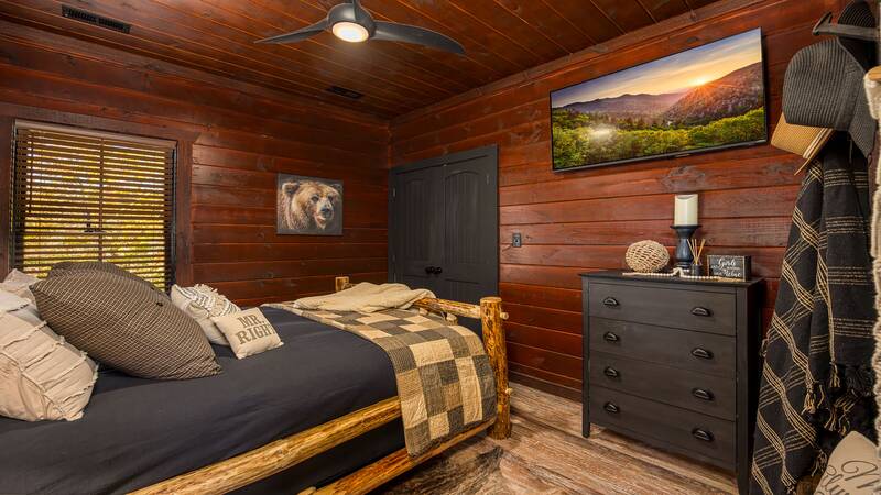 The third cabin bedroom with personal TV. at Stonehenge Cabin in Gatlinburg TN