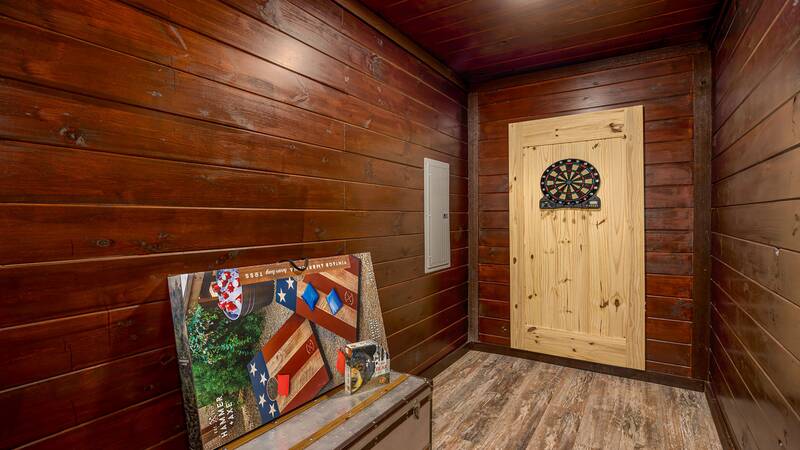Enjoy family competition playing darts or endless games of cornhole.  at Stonehenge Cabin in Gatlinburg TN