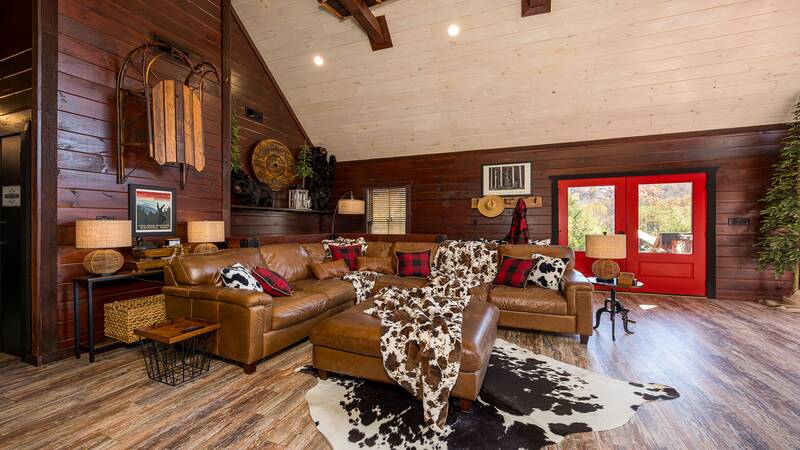 Valuted cabin ceilings and plush furnishings fill this luxury cabin in the Smokies. at Stonehenge Cabin in Gatlinburg TN