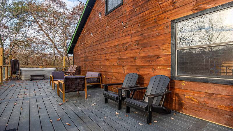 Plenty of deck seating for family and friends to enjoy the great outdoors. at Mountain Whispers in Gatlinburg TN