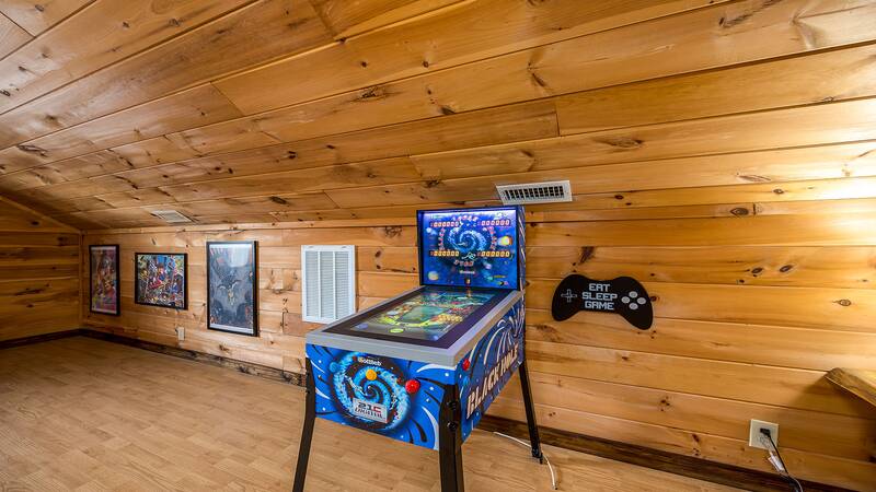 Cabin rental's game room with pinball machine. at Mountain Whispers in Gatlinburg TN