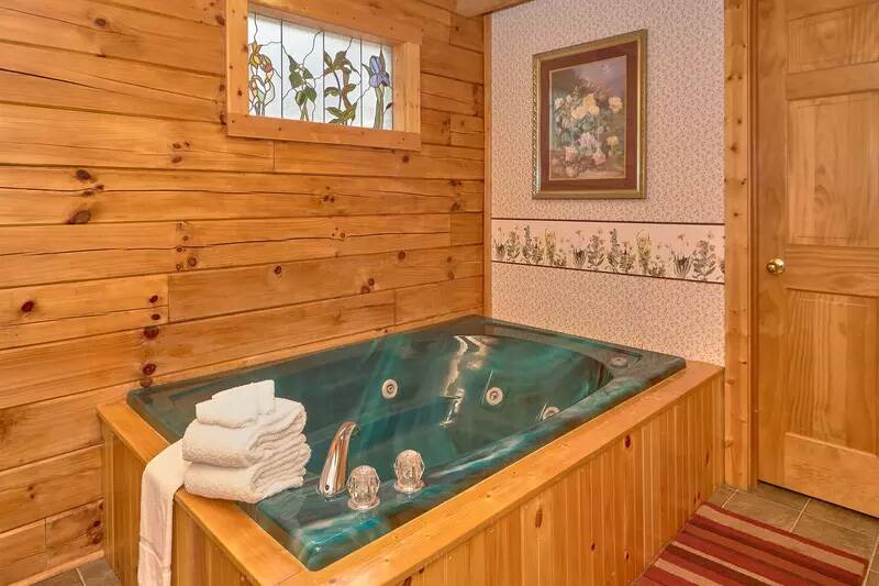 Pamper yourself in this cabin rental's large jacuzzi tub. at Wrap Around The Son in Gatlinburg TN