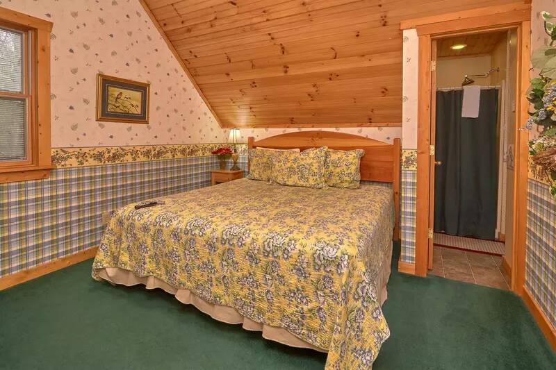 Cabin rental's second bedroom with king bed. at Wrap Around The Son in Gatlinburg TN
