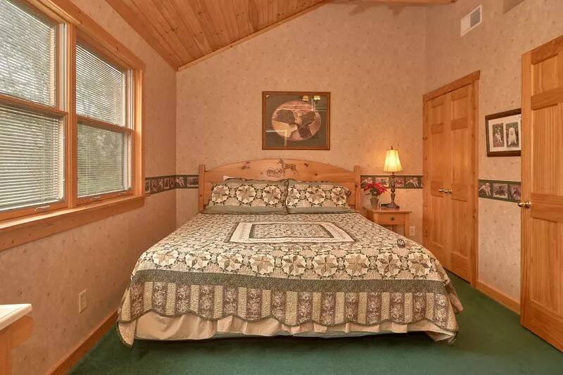 Cabin in the Smokies third bedroom with king bed. at Wrap Around The Son in Gatlinburg TN