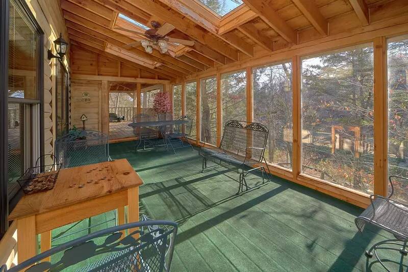 Large sunroom in your Smoky Mountain cabin rental. at Wrap Around The Son in Gatlinburg TN