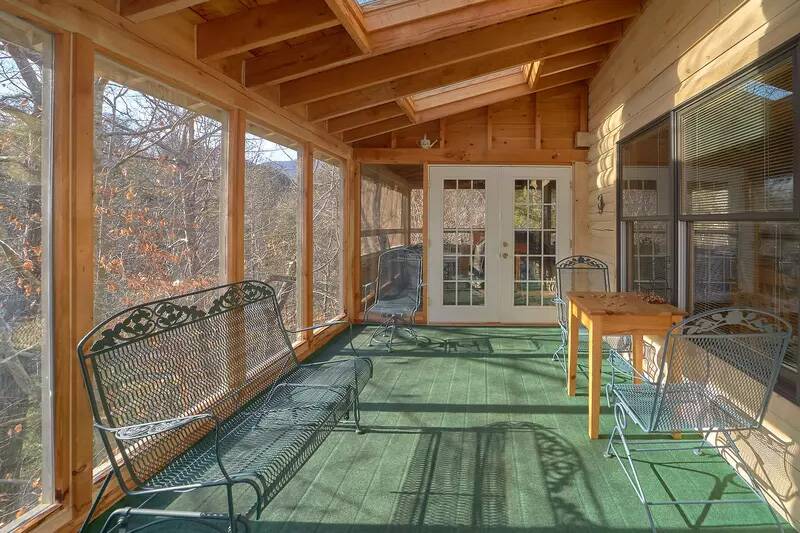 Relaxing seating indoors but wide open to nature. at Wrap Around The Son in Gatlinburg TN