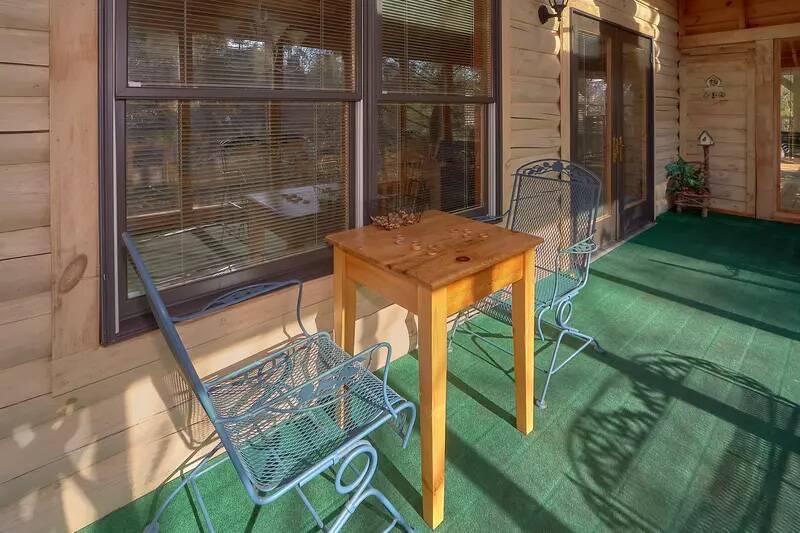Come to the Smoky Mountains and enjoy breakfast in this cabin rentals large sunroom. at Wrap Around The Son in Gatlinburg TN