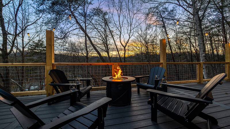 A beautiful sunset and gas fire pit from your cabin in the Smokies. at Mountain Whispers in Gatlinburg TN