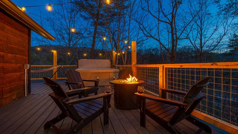 Inviting gas fire pit on the deck of your Smokies cabin. at Mountain Whispers in Gatlinburg TN