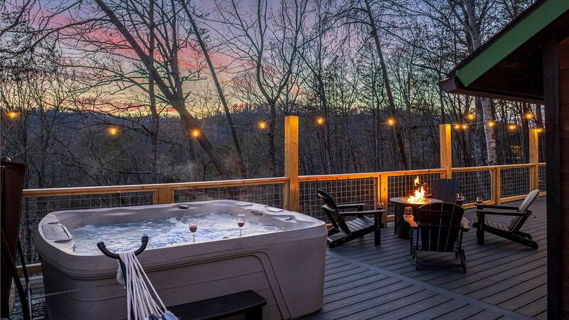 Your cabin offers a wonderful hot tub and gas fire pit. at Mountain Whispers in Gatlinburg TN
