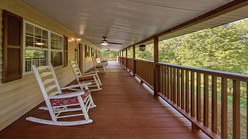 Large porch on the front of your vacation rental. at Bear Splashin Fun in Gatlinburg TN