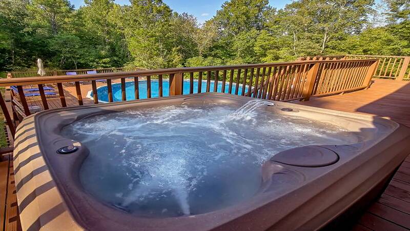 Vacation home with a hot tub in the Smoky Mountains of Tennessee. at Bear Splashin Fun in Gatlinburg TN