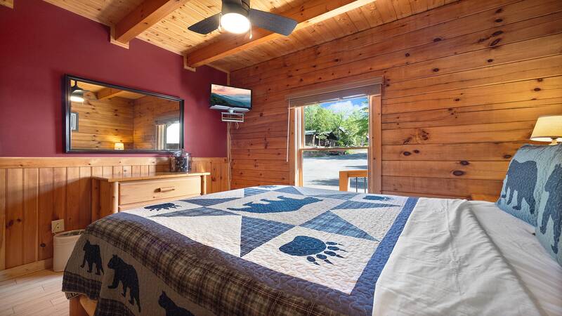 Feel at home in your well furnished cabin bedroom. at Moonlight Pines Lodge in Gatlinburg TN