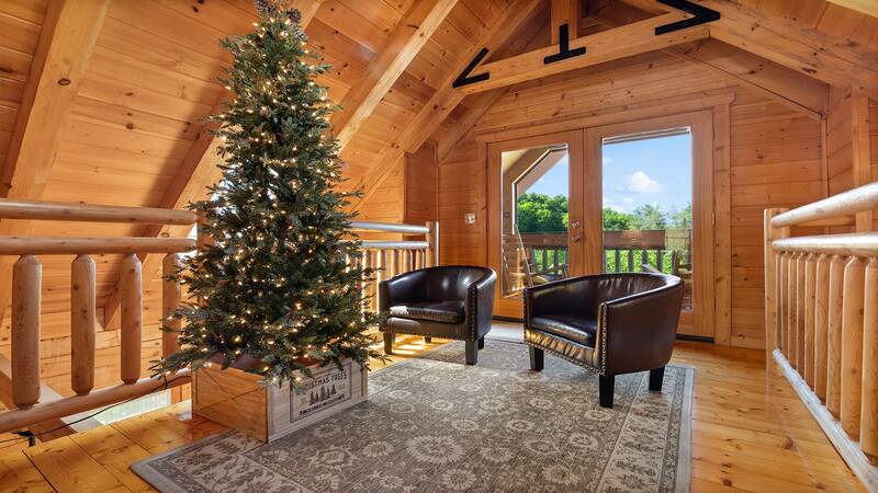 Loft seating along with walkway out onto the loft porch. at Moonlight Pines Lodge in Gatlinburg TN