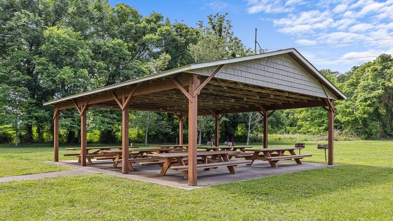 The family can enjoy picnics under the pavilion with several charcoal grills available. at River Waltz in Gatlinburg TN