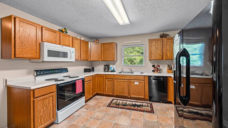 Enjoy snacks to family meals in your cabin kitchen. at Bear Crossing in Gatlinburg TN