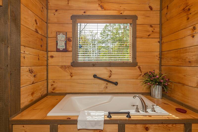 Cabin;s master bedroom Jacuzzi tub for relaxation after a fun filled day in the Smokies. at The Appalachian in Gatlinburg TN