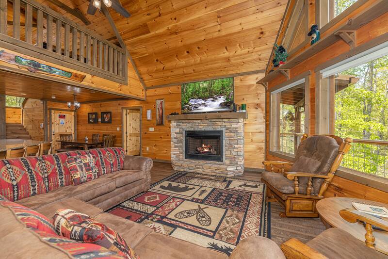 Enjoy the open Smoky Mountain cabin feel from this spacious seating area. at The Appalachian in Gatlinburg TN