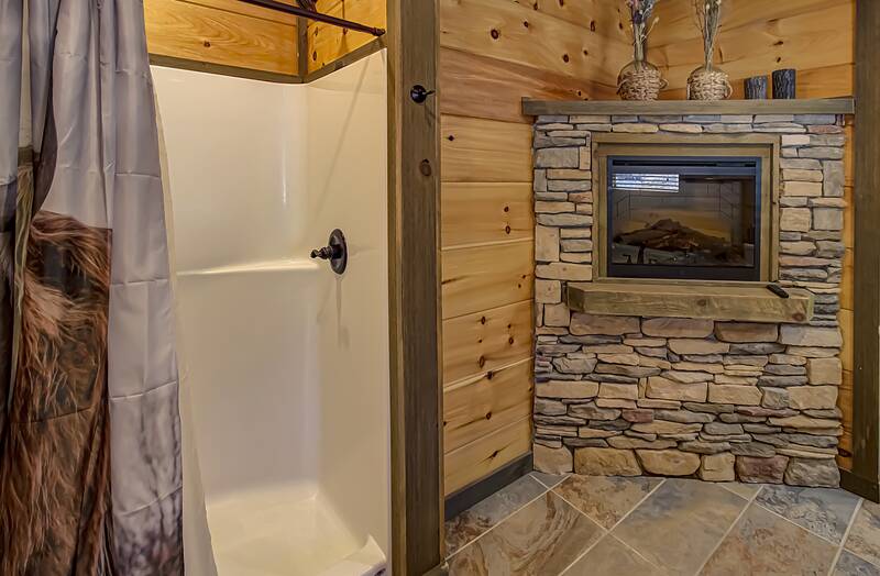 Your cabin bath with fireplace. at A Point of View in Gatlinburg TN