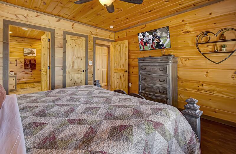 King sized bedroom with tv and full bath. at A Point of View in Gatlinburg TN