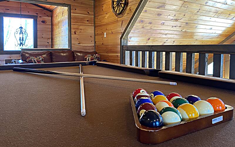 Discover family fun on you cabin's pool table. at A Point of View in Gatlinburg TN