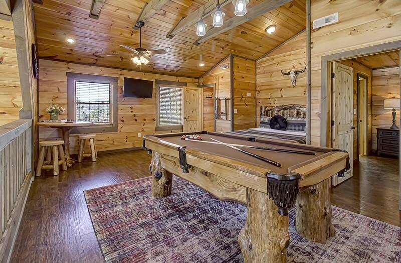 Pool table in the loft of your rental cabin. at A Point of View in Gatlinburg TN