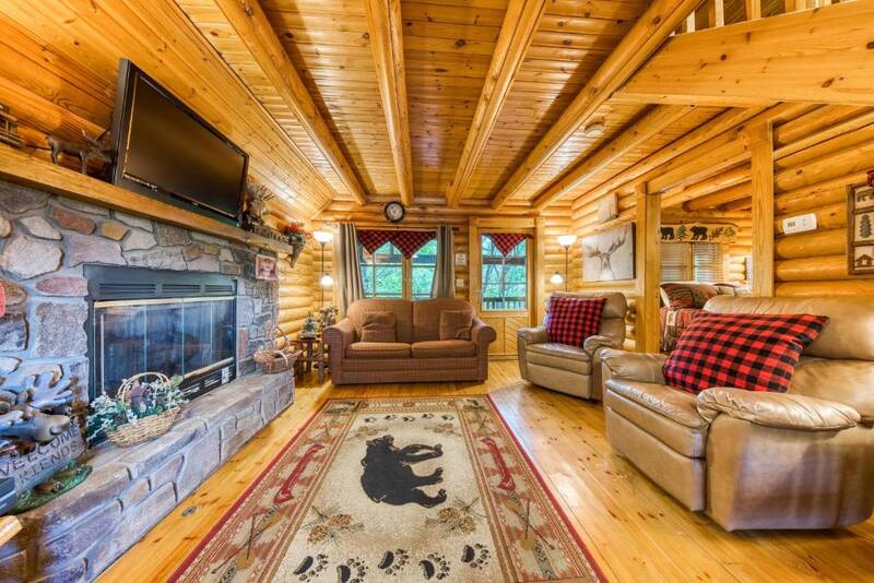 Living room of your Smoky Mountains 1 bedroom cabin. at Moose Lodge in Gatlinburg TN