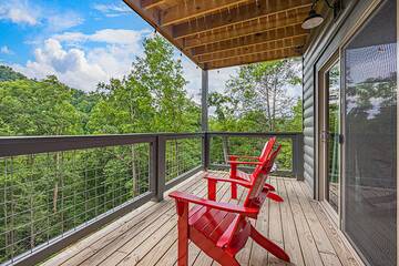 Seating across thew porch of your Smoky Mountains cabin rental.