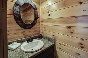 Sink area of your cabin's half-bath. at A Great Escape in Gatlinburg TN