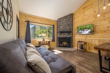 Enjoy this Gatlinburg condo living room with its gas log fireplace. at A Moonlit Kiss in Gatlinburg TN