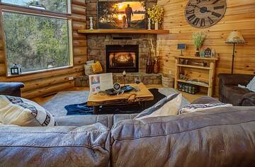 Seasonal gas log fireplace at you log cabin rental.
