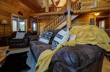 Living room of your 4 bedroom cabin rental in the Smokies. at A Great Escape in Gatlinburg TN