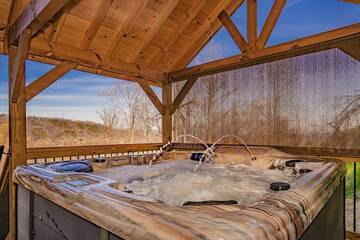 Romantic covered hot tub at your Smoky Mountains cabin rental.