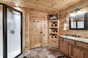 Cabin rental with glass shower.