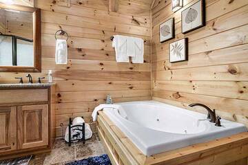 Enjoy the warm bubbles of a jacuzzi bath. at Alpine Oasis in Gatlinburg TN
