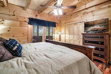 Bedroom with television and walk out onto porch.